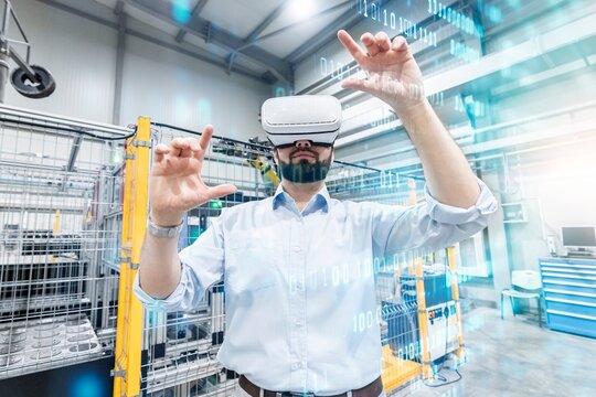 Engineer using Virtual Reality Simulator for binary codes at modern industry