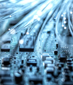 Blue fiber optics wires transferring data into computer hardware