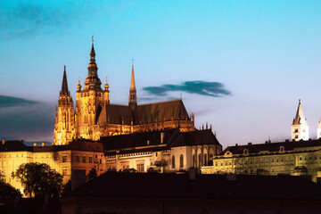 Fototapeta premium Prague castle in the sunset with the Moon in the background.