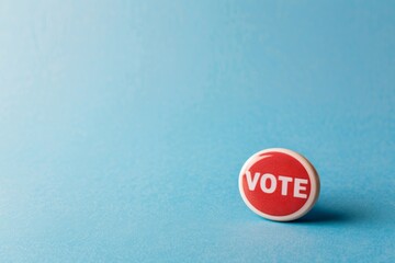 A bright red sticker with the word Vote prominently displayed sits on a calm blue background, encouraging citizens to take part in the democratic process and shape their future.