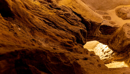 A cave with a small opening in the middle
