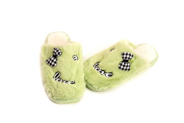 The green female slippers on a white background