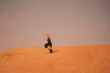 person walking in desert