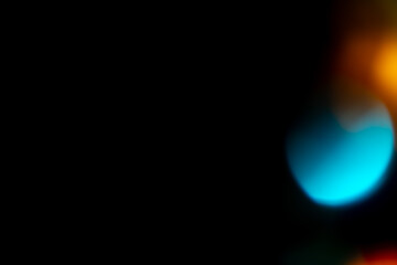 Multicolored highlights on a black background. for overlay to create a festive, vibrant effect