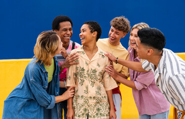 Group of friends are happy for young woman and encouraging her