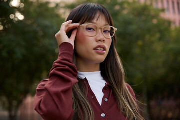 Confident young woman wearing eyeglasses