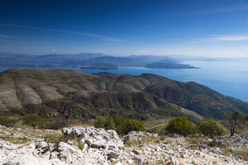 Fototapeta premium View of Albanian coastline and mountains, from mount Pantokrator, Corfu, Greece