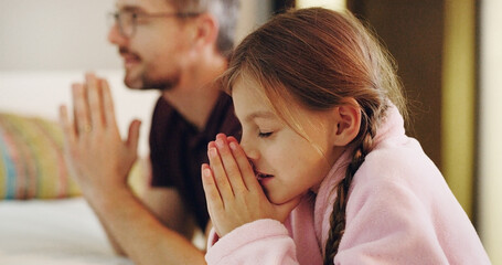 Child, man and religion with praying on bed together in home for bedtime faith or worship. Belief,...