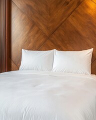 Cozy wooden bedroom interior with white bedding