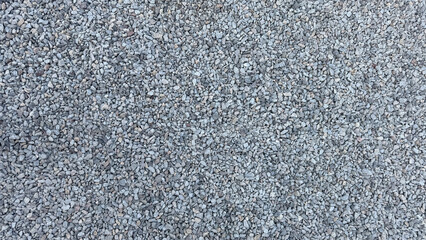 Texture from a pile of grey crushed stone.