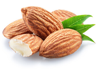Almond nuts and green leaves isolated on white background. File contains clipping path.