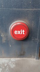 A red button with a sign that says exit  