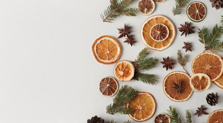 Natural organic banner with dried oranges, cones, star anises and fir twigs. Holidays concept, natural background.