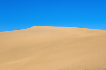 The landscape of desert against blue sky