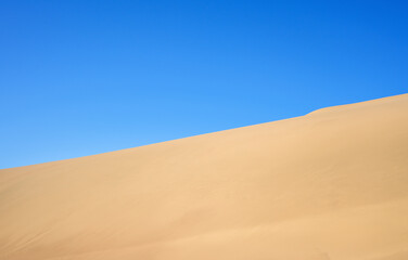 The landscape of desert against blue sky