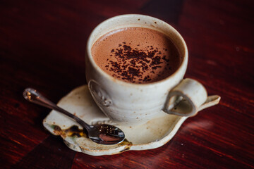 a cup of hot cocoa with chocolate powder