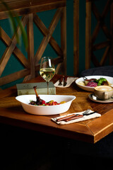 Beautifully served dinner in a restaurant, dishes from the chef, signature cuisine