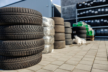 Mechanic workshop with tire stacks.