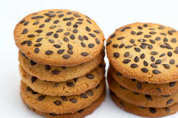 And white cookies with seeds on white. food snack sweet concept. a round cookie with seeds on a white . a round cookie with seeds on a lifestyle white.