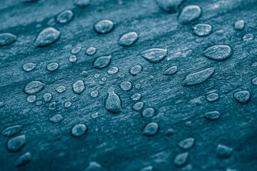 raindrops on the wooden surface, blue background, rainy days