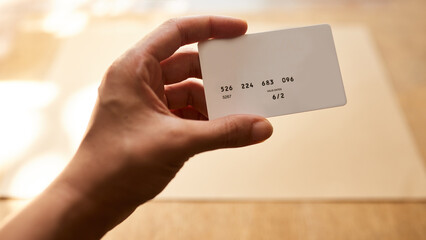 Person, hands or credit card with expiration date for payment, transaction or valid numbers at...