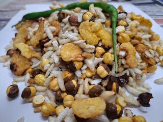 A savory mix of gram, peanuts, sprouted beans, and chilies, creating a flavorful, protein-packed, and spicy snack delight!