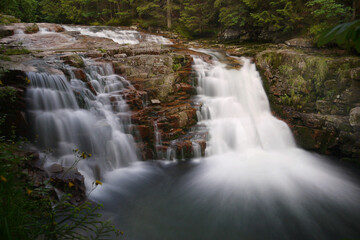Fototapeta premium Mountain stream waterfall long exposure time
