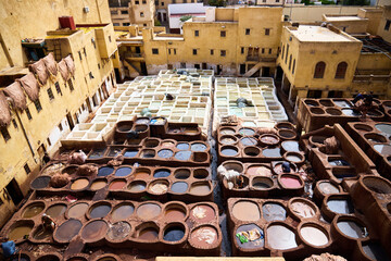 People works in the Shuara leather dyeing factory. Traditional Moroccan craft.