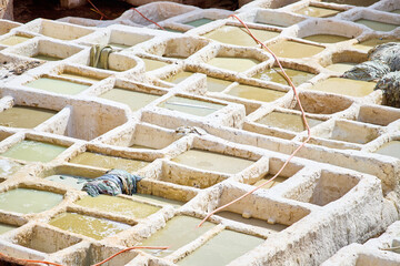 People works in the Shuara leather dyeing factory. Traditional Moroccan craft.