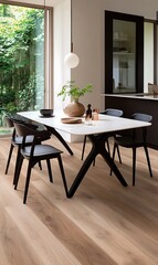 Obraz premium Minimalist dining room interior with a white table, black chairs, and wood flooring.