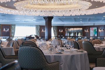 Formal and elegant ocean view dining room restaurant onboard luxury cruiseship or cruise ship liner...