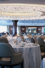 Formal and elegant ocean view dining room restaurant onboard luxury cruiseship or cruise ship liner...