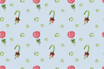 Seamless pattern with colorful lollipops and festive bows on a blue background.