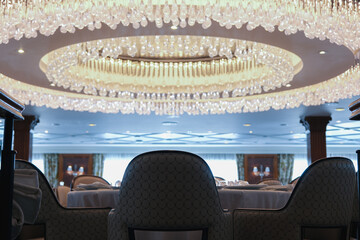 Formal and elegant ocean view dining room restaurant onboard luxury cruiseship or cruise ship liner...