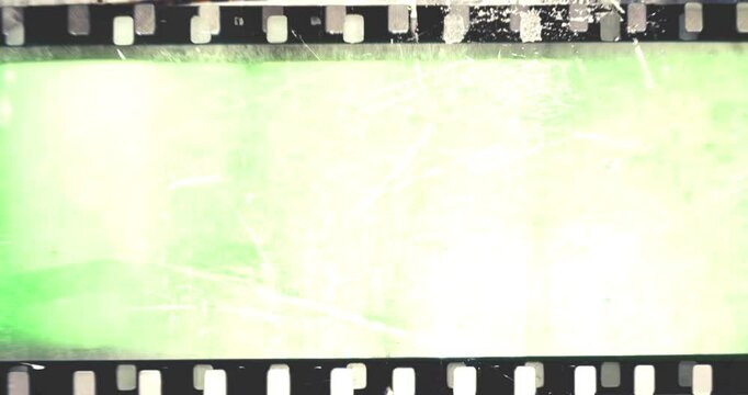 film strip transition, with chroma key green screen background, effect of old film rolling with details, scratches and grain, vintage strip intro