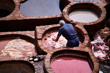 People works in the Shuara leather dyeing factory. Traditional Moroccan craft.