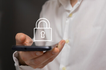 Man holding a smartphone with a padlock icon on the screen.