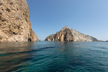Naklejka premium golden island seen from the turquoise sea Palmarola Island