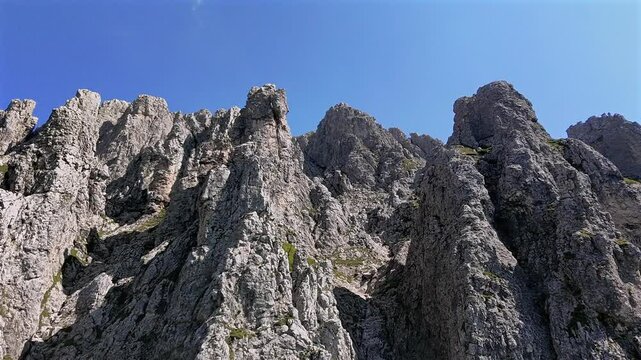 Rocky wall, mountain, summer season, Grignetta, Alps, Italy, Aerial drone ascending