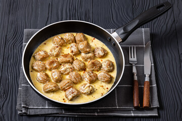 Ground poultry meatballs in a white cream gravy