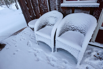 Garden furniture after snowstorm in the winter