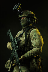 Portrait of Soldier in Tactical Gear with Night Vision Goggles and Rifle