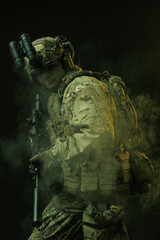 Soldier in Tactical Gear with Night Vision Goggles Amidst Smoke