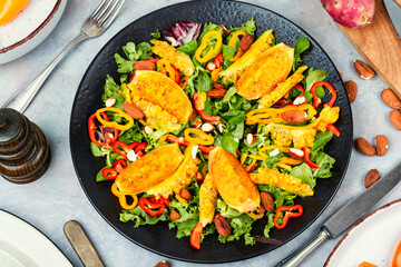 Salad of cactus fruits, peppers and almonds.