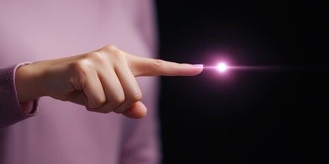 A close-up of a finger touching a glowing purple light, symbolizing innovation.