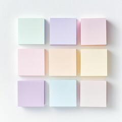 Fototapeta premium Nine pastel-colored sticky notes on white background.