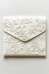 Embossed floral design on white envelope.