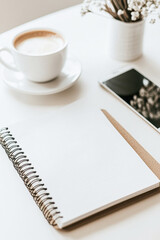 Create a productive workspace with coffee and notepad