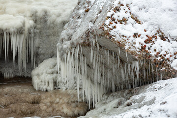 Icy building constructions in sea in winter