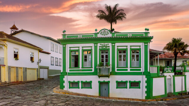 DIAMANTINA, MINAS GERAIS, BRAZIL: colorful "pousada" in historic center, AirBnb style, cobbled streets with traditional houses, green, yellow and white walls, terracotta roof tiles
